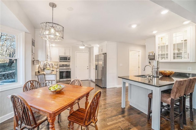 dining room featuring a ceiling fan, dark wood-type flooring, recessed lighting, and baseboards