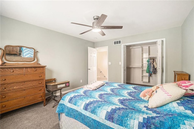 carpeted bedroom featuring a closet, visible vents, baseboards, and ceiling fan