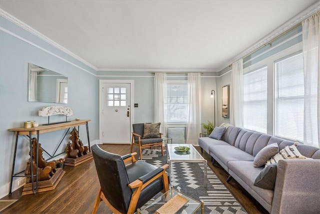 living area with crown molding, dark wood finished floors, and baseboards