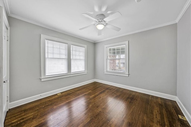 unfurnished room with dark wood-style floors, crown molding, baseboards, and a ceiling fan