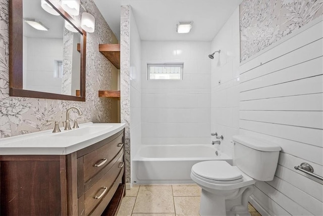 bathroom featuring wallpapered walls, toilet, tub / shower combination, vanity, and tile patterned floors