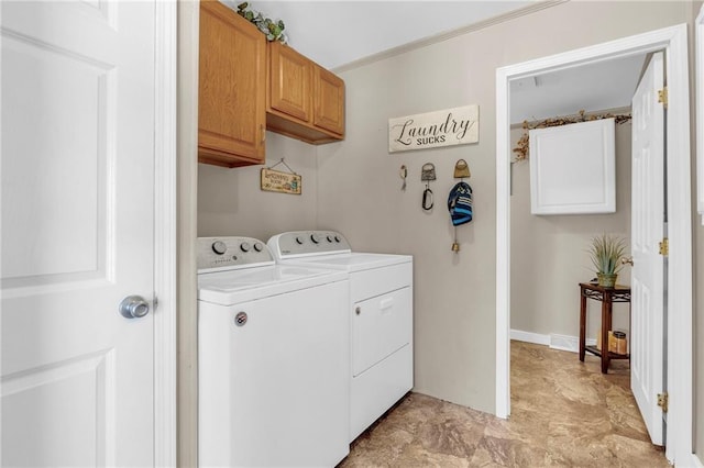 washroom with cabinet space and washer and clothes dryer