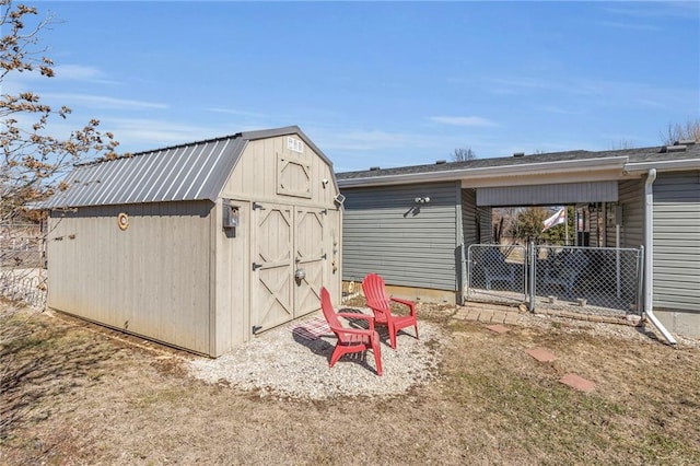 view of shed with fence