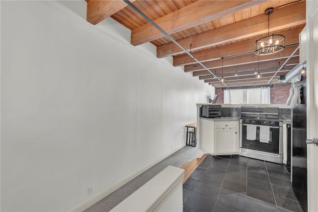 kitchen featuring an inviting chandelier, wood ceiling, white cabinets, gas range, and beamed ceiling