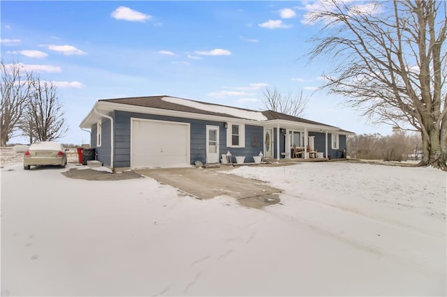 ranch-style home with driveway and an attached garage