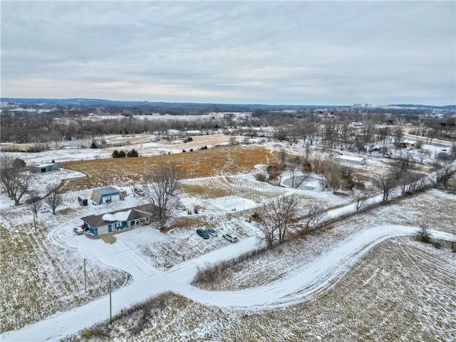 snowy aerial view featuring a rural view