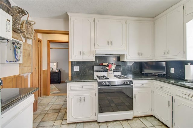 kitchen featuring decorative backsplash, white cabinets, a textured ceiling, white appliances, and under cabinet range hood