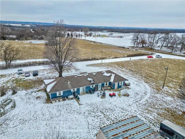 snowy aerial view featuring a rural view