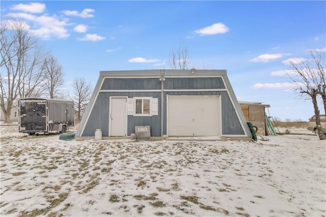 view of snow covered garage