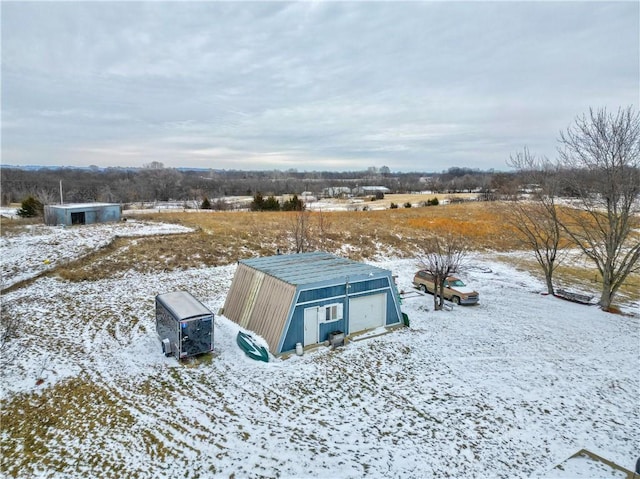 snowy aerial view with a rural view