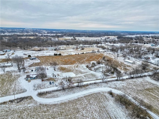 snowy aerial view with a rural view