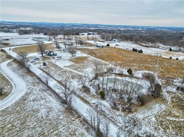 snowy aerial view with a rural view