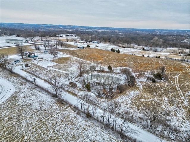 snowy aerial view with a rural view