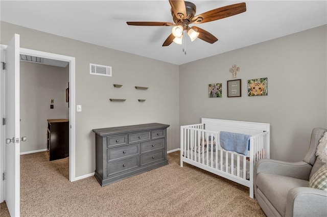 bedroom featuring visible vents, carpet floors, baseboards, and a ceiling fan