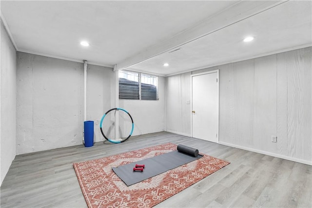 workout room featuring wood finished floors and recessed lighting