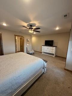 bedroom with ceiling fan, carpet, and visible vents