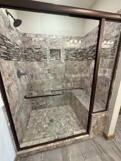 bathroom with a shower stall