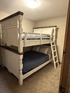 unfurnished bedroom featuring dark colored carpet