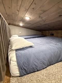 bedroom with lofted ceiling and wood ceiling