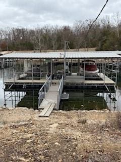 dock area featuring a water view and boat lift