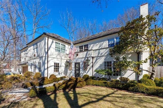 exterior space featuring a front yard and a chimney