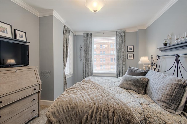 bedroom with carpet floors, baseboards, and ornamental molding