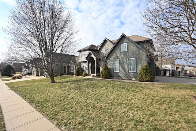 traditional-style home with stucco siding and a front yard