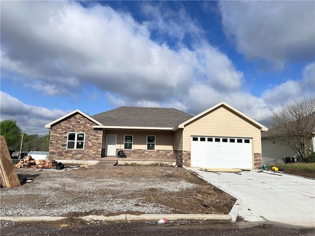 1107 Charles St, Knob Noster, MO 65336 - ranch-style home featuring concrete driveway, an attached garage, and stone siding