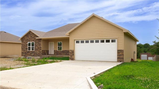 1107 Charles St, Knob Noster, MO 65336 - view of front of home with stone siding, an attached garage, concrete driveway, roof with shingles, and a front lawn