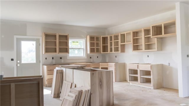 1107 Charles St, Knob Noster, MO 65336 - kitchen with a center island, open shelves, and light brown cabinetry