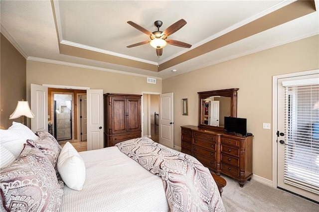 bedroom featuring access to outside, a raised ceiling, visible vents, and light colored carpet