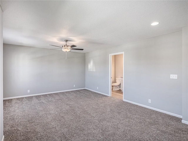 carpeted empty room featuring ceiling fan, baseboards, a textured ceiling, and recessed lighting