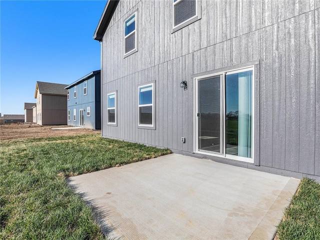 rear view of property with a patio area and a yard