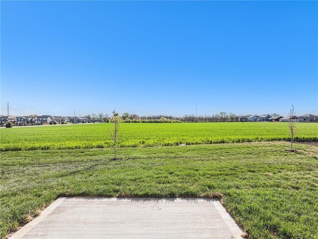 view of yard with a rural view