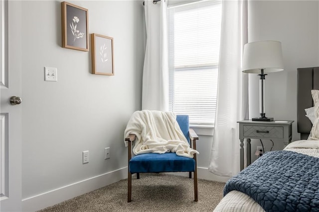 carpeted bedroom featuring baseboards