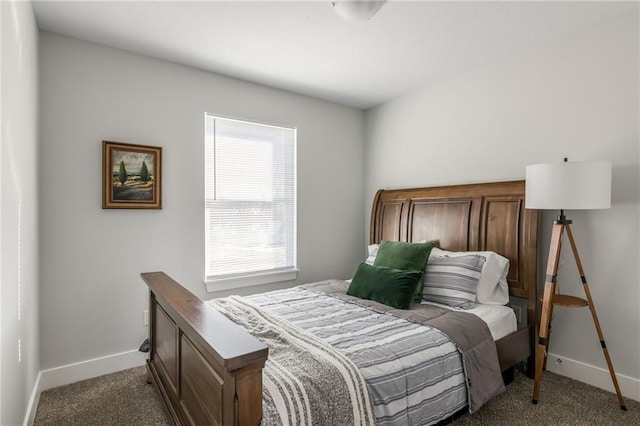 bedroom with baseboards and carpet floors