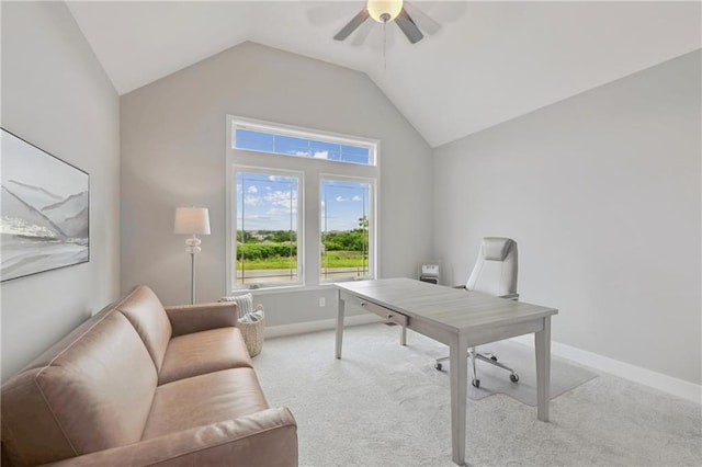 office space with light carpet, ceiling fan, lofted ceiling, and baseboards