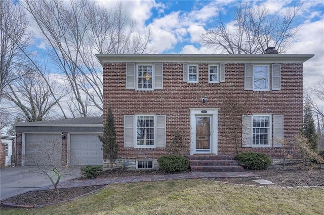 view of front of property featuring concrete driveway, brick siding, a chimney, and an attached garage