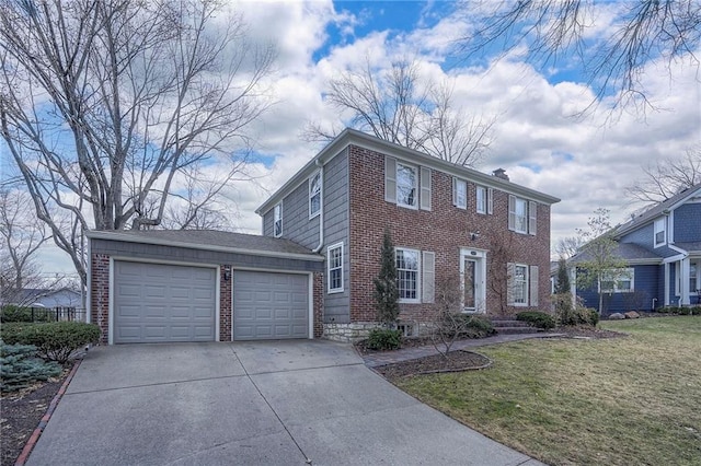 colonial home with a garage, a front lawn, concrete driveway, and brick siding