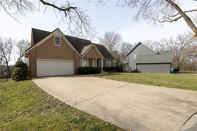 view of front of home with a garage, brick siding, concrete driveway, and a front yard