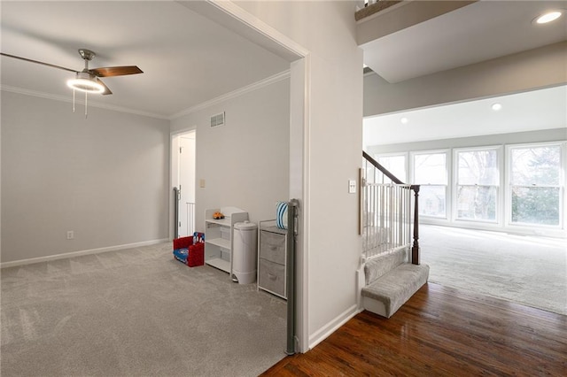 corridor featuring recessed lighting, baseboards, and ornamental molding