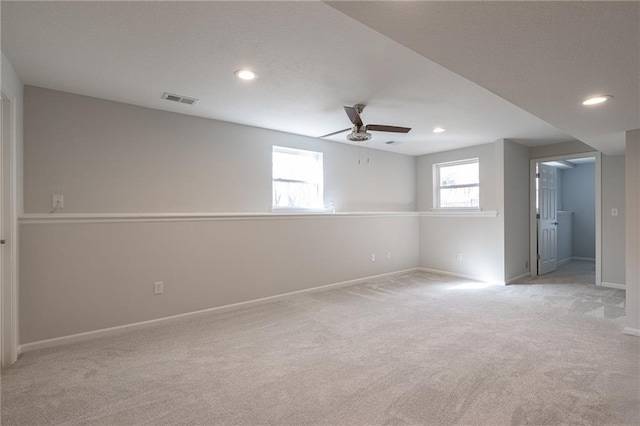 interior space featuring recessed lighting, visible vents, light colored carpet, and a ceiling fan