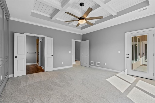 unfurnished bedroom with carpet floors, coffered ceiling, visible vents, baseboards, and crown molding