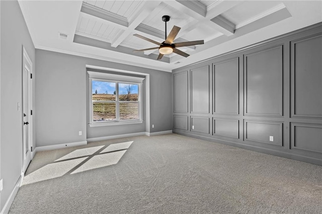 unfurnished bedroom with beam ceiling, light colored carpet, visible vents, ornamental molding, and coffered ceiling