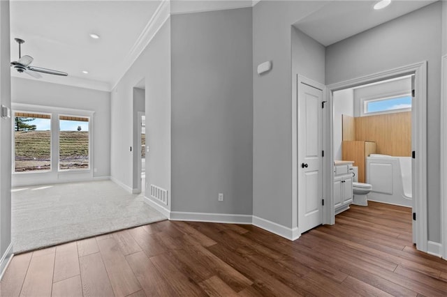 2409 Merlot Pl, Excelsior Springs, MO 64024 - hallway with ornamental molding, wood finished floors, and recessed lighting