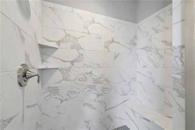 full bathroom with tiled shower
