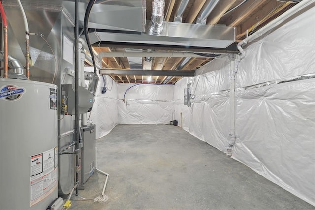 unfinished basement featuring water heater