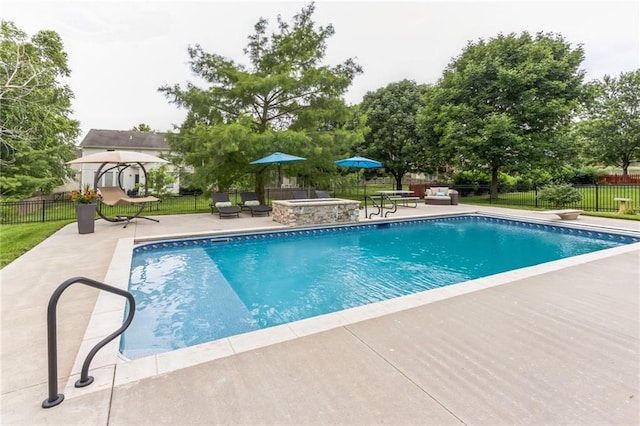 view of pool featuring a patio area, a fenced backyard, and a fenced in pool