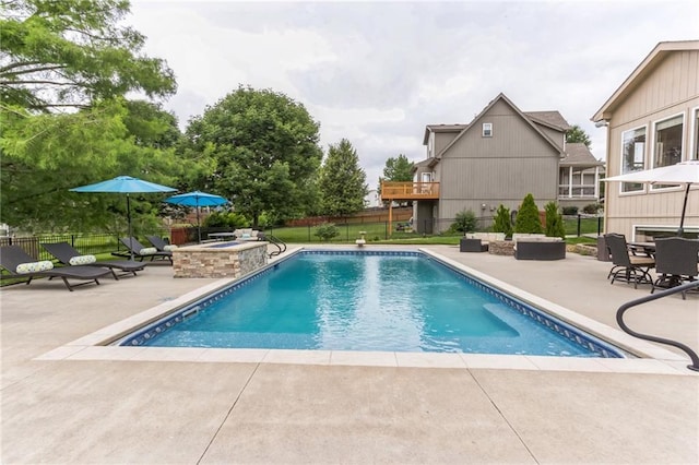 view of pool featuring a patio area, fence, and a fenced in pool