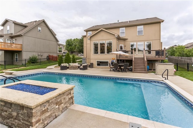 view of pool featuring a fenced in pool, stairway, fence, an outdoor living space, and a wooden deck